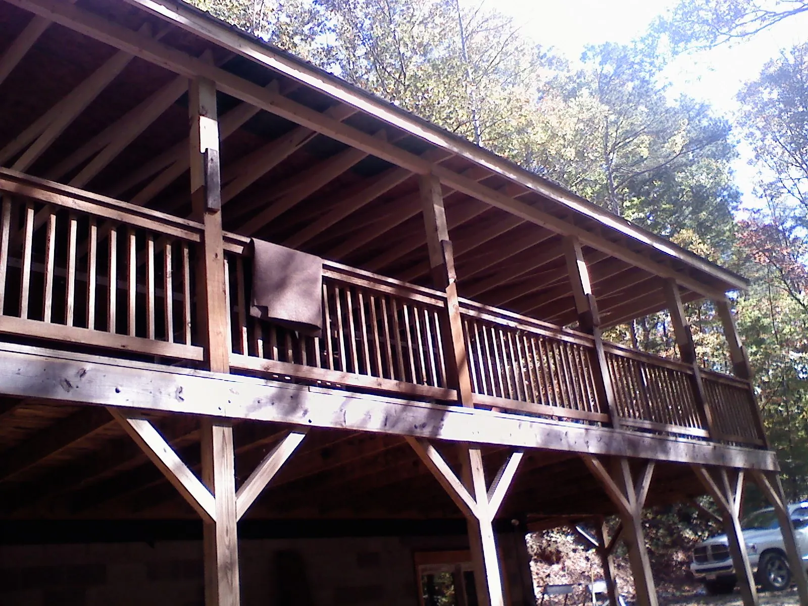 Timber framing under a new elevated porch and deck — Roof Leak Repair in Creedmoor by Roofing Brothers